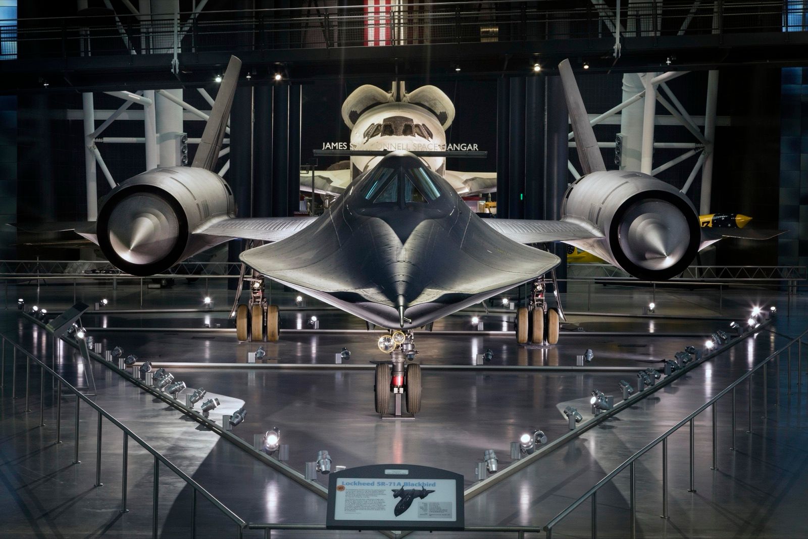 SR-71A 61-7972 seen nose-on in the Boeing Aviation Hangar of the Smithsonian's Steven F. Udvar-Hazy Center, Chantilly, Virginia, with the James S. McDonnell Space Hangar and a Space Shuttle orbiter behind it.