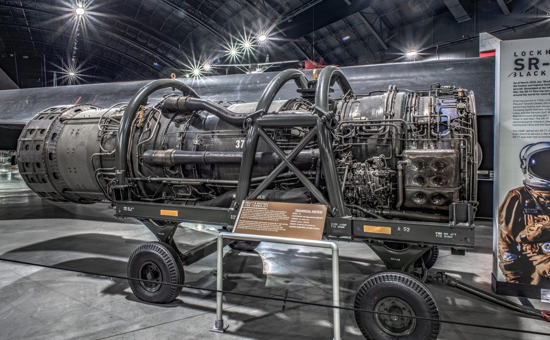 A J58 on its stand at the National Museum of the U.S. Air Force, with its bypass ducts and plumbing on the outside.